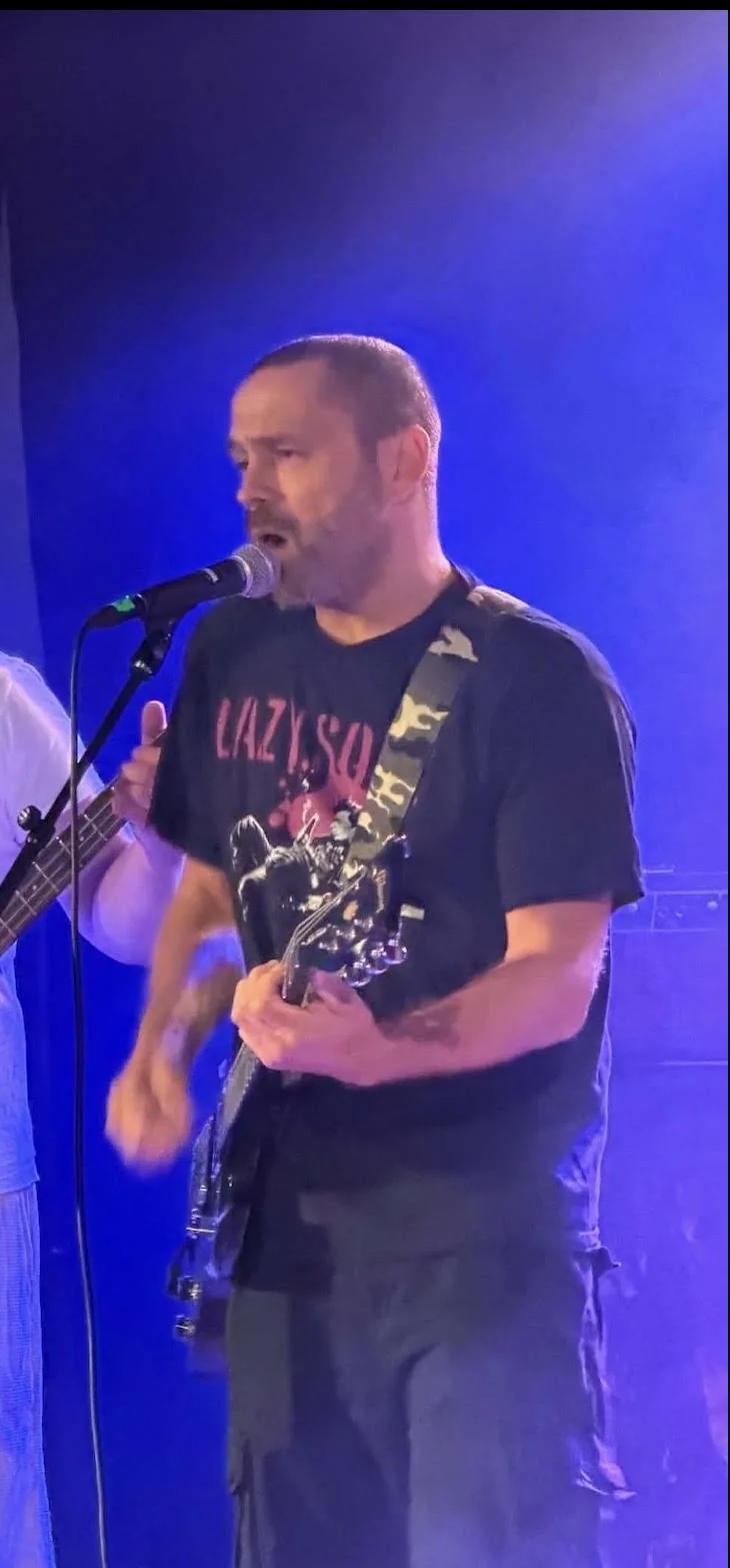 Børge Edvardsen playing rhythm guitar with Fat Lars