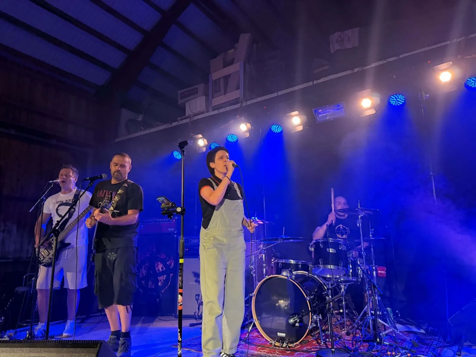 Fat Lars performing live under blue stage lights