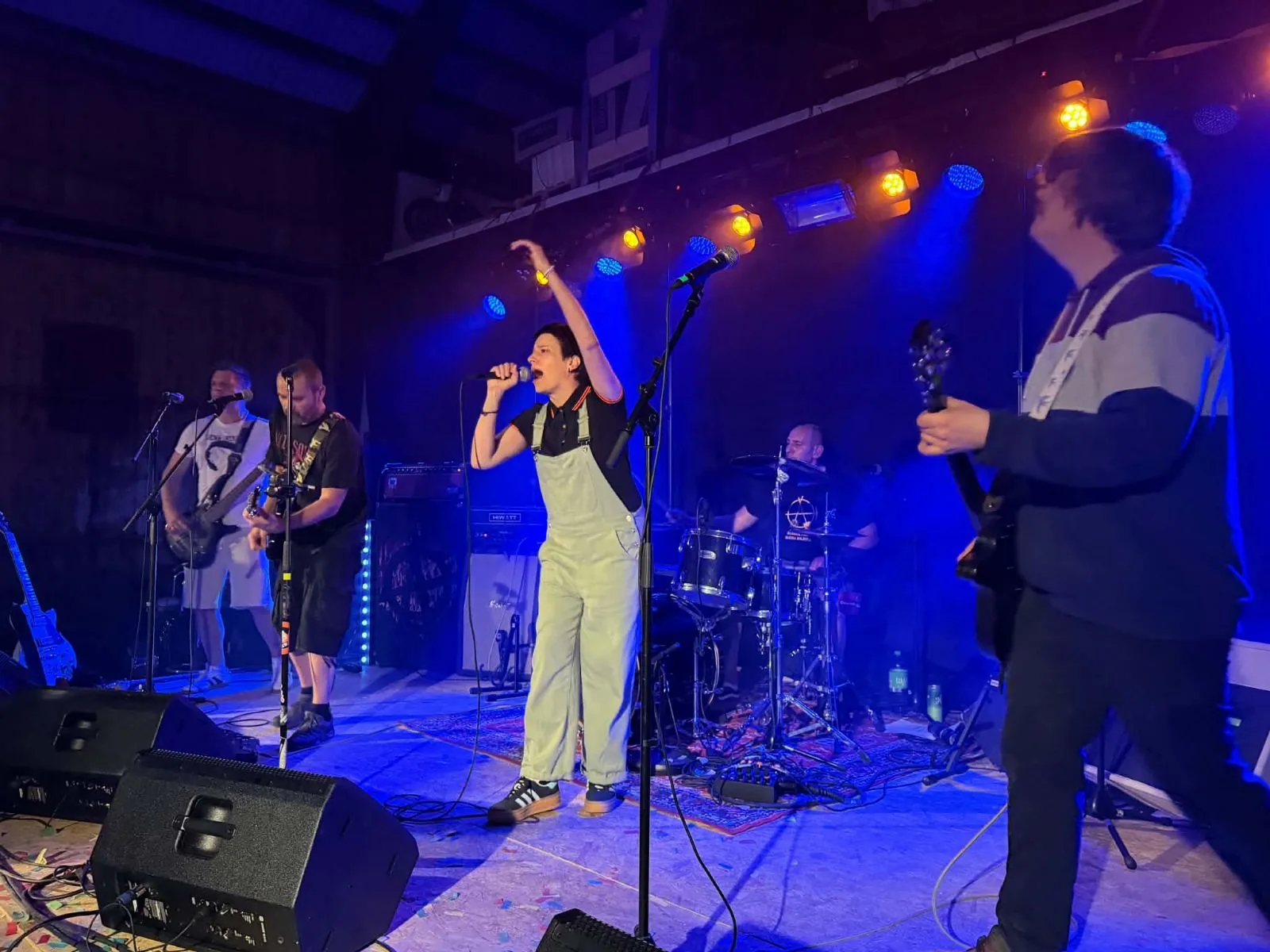 Fat Lars performing live under blue stage lights
